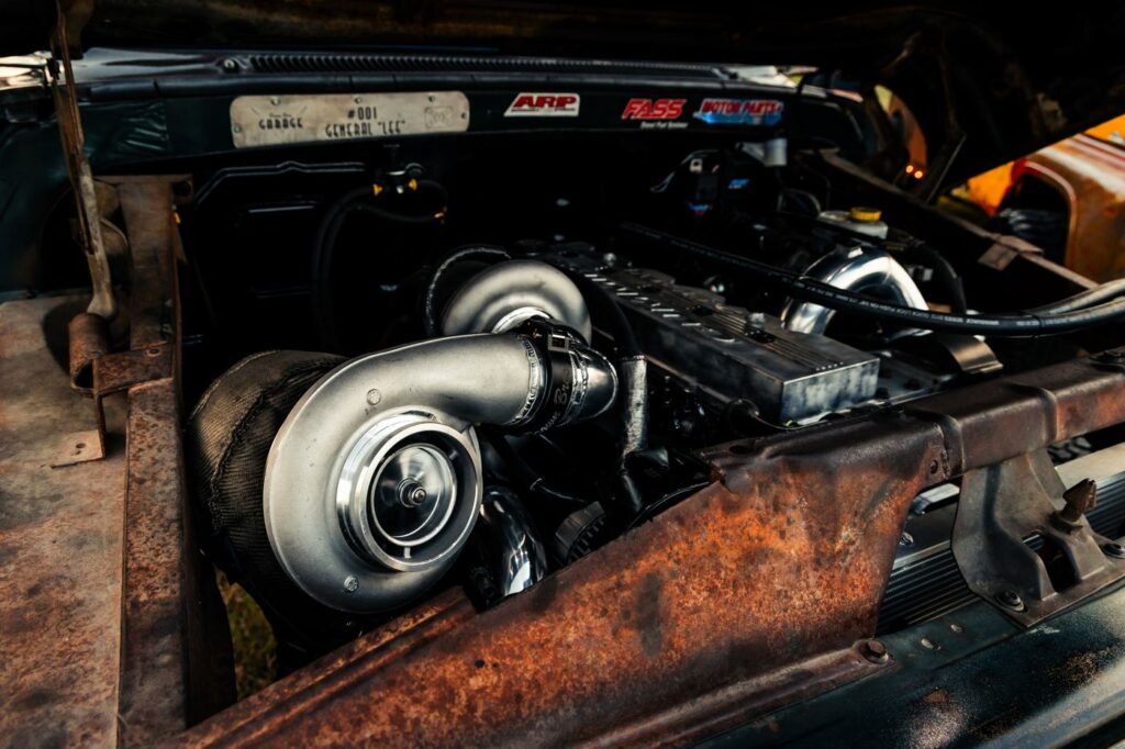 Close-up of a large turbocharger in a diesel engine bay